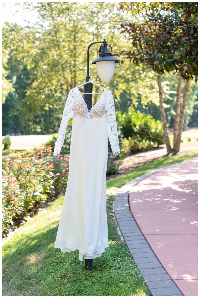 wedding dress hanging from a light post in Maryland