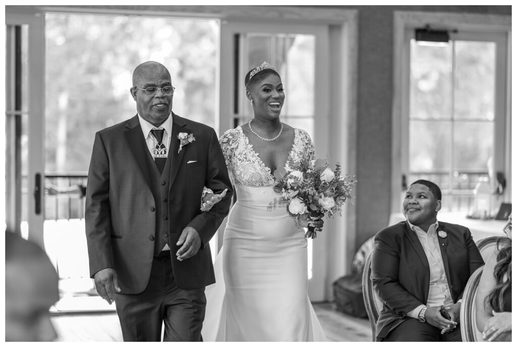 bride walking in with her dad at wedding ceremony