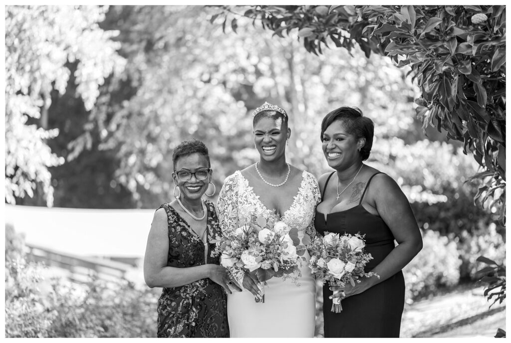 bride laughing with mom and sister at spring wedding in Maryland