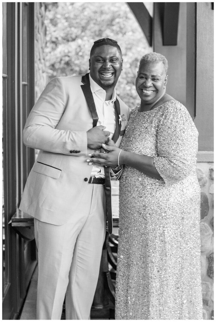 groom and his mom laughing at spring wedding in Maryland
