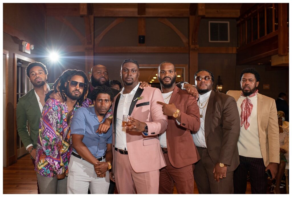 groom posing with friends at Maryland wedding reception