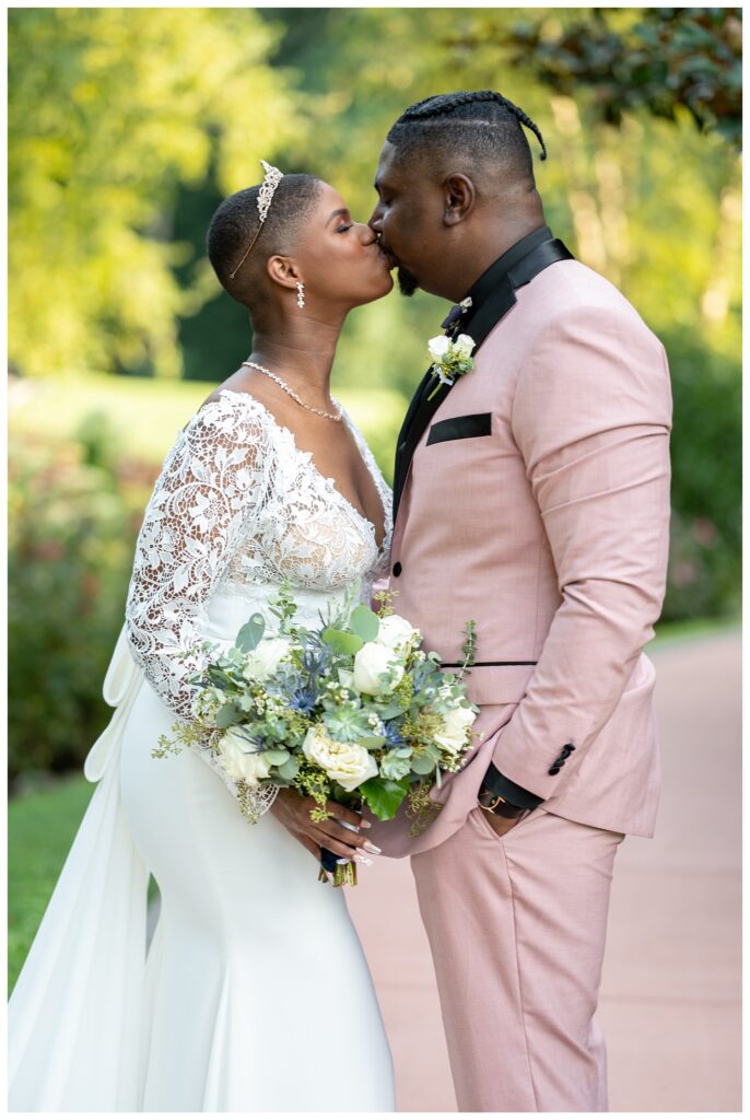 bride and groom kissing during couples portraits in Maryland