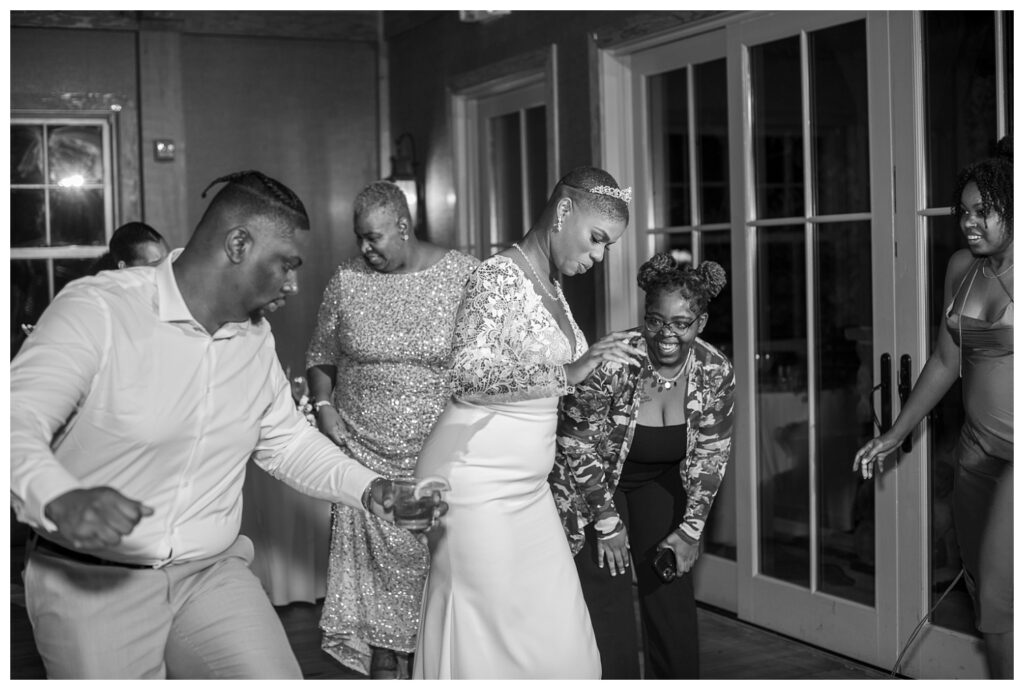 bride and groom dancing with wedding guests at Maryland venue